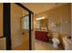 Bright bathroom featuring a glass-enclosed shower, vanity with granite counters, and a soaking tub at 7664 Wilmington Loop, Kissimmee, FL 34747