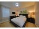 Bedroom with natural light, featuring a Queen sized bed and dark furniture for a cozy and inviting feeling at 7664 Wilmington Loop, Kissimmee, FL 34747