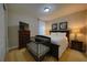 Cozy bedroom with a crib, TV on the dresser, and a comfortable bed at 7664 Wilmington Loop, Kissimmee, FL 34747