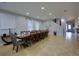 Spacious dining room with seating for twelve, neutral walls and ceramic tile flooring at 7664 Wilmington Loop, Kissimmee, FL 34747