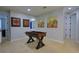 Spacious game room with a foosball table, artwork and doors leading to other rooms at 7664 Wilmington Loop, Kissimmee, FL 34747