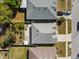 An aerial view of the rooftops and backyards of several homes in a residential neighborhood at 7733 Beridale Ct, Orlando, FL 32818