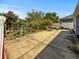 Expansive backyard featuring a concrete patio, greenery, and room for outdoor activities at 7733 Beridale Ct, Orlando, FL 32818