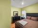 Cozy bedroom with a comfortable bed, dark wood furniture, and soft lighting for relaxation at 7733 Beridale Ct, Orlando, FL 32818
