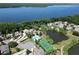 Aerial view showcasing the community's amenities, including a pool, tennis court, and serene lake views at 786 Seneca Meadows Rd, Winter Springs, FL 32708
