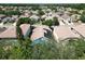 Aerial view of the home with solar panels and a blue lanai at 786 Seneca Meadows Rd, Winter Springs, FL 32708