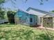Landscaped backyard showcasing lanai and shed at 786 Seneca Meadows Rd, Winter Springs, FL 32708