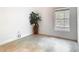 Cozy bedroom with tiled floors, natural light, and a decorative houseplant at 786 Seneca Meadows Rd, Winter Springs, FL 32708