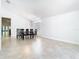 Open-concept dining room with tile floors and large window bringing in light at 786 Seneca Meadows Rd, Winter Springs, FL 32708