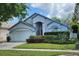 Charming single-Gathering home with a well-manicured lawn and beautiful blue exterior at 786 Seneca Meadows Rd, Winter Springs, FL 32708