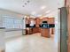 Well-lit kitchen with granite counters, stainless steel appliances, and a kitchen island at 786 Seneca Meadows Rd, Winter Springs, FL 32708