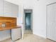 Bright office features custom cabinets, wood accents and access to another room at 786 Seneca Meadows Rd, Winter Springs, FL 32708
