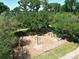 Community playground nestled among mature trees, perfect for outdoor activities and recreation at 786 Seneca Meadows Rd, Winter Springs, FL 32708