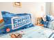 bedroom showing a Star Wars-themed bedding set on two cozy beds at 9036 Stinger E Dr, Davenport, FL 33896