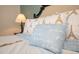 Inviting bedroom with Eiffel Tower themed pillows creating a cozy and stylish space at 9036 Stinger E Dr, Davenport, FL 33896