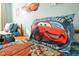 Fun bedroom featuring 'Cars' themed bedding and decor, perfect for a space at 9036 Stinger E Dr, Davenport, FL 33896