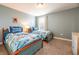 Cozy bedroom with twin beds, Star Wars themed bedding, and a light blue wall at 9036 Stinger E Dr, Davenport, FL 33896