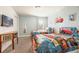 Bright bedroom with twin beds, themed bedding, and playful decor, complete with mounted TV at 9036 Stinger E Dr, Davenport, FL 33896
