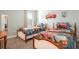 Whimsical bedroom with twin beds, themed bedding, and playful decor, perfect for  at 9036 Stinger E Dr, Davenport, FL 33896