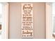 Motivational wall decor adding a personal and uplifting touch to the home interior at 9036 Stinger E Dr, Davenport, FL 33896
