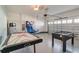 Finished garage with games: an air hockey table and foosball, and a basketball game at 9036 Stinger E Dr, Davenport, FL 33896