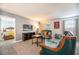 A relaxing living room offers a view to a bedroom through a doorway at 9036 Stinger E Dr, Davenport, FL 33896