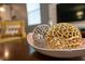 Stylish gold and silver decorative orbs on a polished wood table enhance the living space at 9036 Stinger E Dr, Davenport, FL 33896