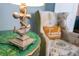 Charming accent table with a nautical-themed lamp and a comfortable chair in the background at 9036 Stinger E Dr, Davenport, FL 33896