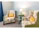 Charming sitting area featuring ornate chairs and a table with decorative accents at 9036 Stinger E Dr, Davenport, FL 33896