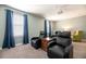 This theater room has reclining chairs and a projector for movie viewing enjoyment at 9036 Stinger E Dr, Davenport, FL 33896