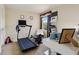 Bedroom featuring a treadmill, rowing machine, desk, and decor at 9535 Silver Buttonwood St, Orlando, FL 32832