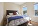 Bedroom with a comfortable queen-sized bed, plush pillows, and natural light streaming in from the windows at 9535 Silver Buttonwood St, Orlando, FL 32832
