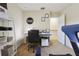 Bedroom featuring a desk, shelves, and exercise equipment for a versatile space at 9535 Silver Buttonwood St, Orlando, FL 32832