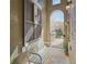 Charming entryway with bench, decorative shutter, and gated access at 9535 Silver Buttonwood St, Orlando, FL 32832