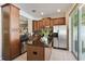 Spacious kitchen featuring a stainless steel fridge, a center island, and lots of storage at 9535 Silver Buttonwood St, Orlando, FL 32832