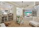 This spacious living room features a modern fireplace, chandelier, and an open view to the kitchen at 9535 Silver Buttonwood St, Orlando, FL 32832
