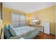 Cozy bedroom with hardwood floors, natural light, and a serene atmosphere at 1048 Lake Berkley Dr, Kissimmee, FL 34746