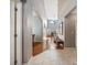 Bright entryway featuring tile and hardwood flooring, leading to a staircase and living area at 1048 Lake Berkley Dr, Kissimmee, FL 34746