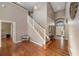 Inviting foyer showcasing hardwood floors, a staircase, and high ceilings at 1048 Lake Berkley Dr, Kissimmee, FL 34746