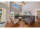 Inviting living room with high ceilings, hardwood floors, and a large window for natural light at 1048 Lake Berkley Dr, Kissimmee, FL 34746