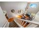 High-angle view of a living room with hardwood floors, a large window, and staircase at 1048 Lake Berkley Dr, Kissimmee, FL 34746