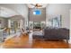 Open living area with high ceilings, hardwood floors, and access to the dining area and backyard at 1048 Lake Berkley Dr, Kissimmee, FL 34746