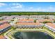 Overhead image showcasing a waterfront home with a screened patio and nearby lake at 1149 S Beach Cir, Kissimmee, FL 34746