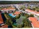 Overhead view of a community showcasing the pool, tennis courts and tile roofs at 1149 S Beach Cir, Kissimmee, FL 34746