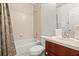 Clean bathroom with a tiled tub/shower, vanity, and essential fixtures for a functional space at 1149 S Beach Cir, Kissimmee, FL 34746
