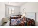 Comfortable bedroom with twin beds, a window for natural light, and a calm, neutral decor at 1149 S Beach Cir, Kissimmee, FL 34746