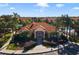 Charming clubhouse featuring a terracotta roof, well-maintained landscaping, and inviting entryway at 1149 S Beach Cir, Kissimmee, FL 34746