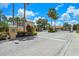 Gated community entrance featuring manicured landscaping at 1149 S Beach Cir, Kissimmee, FL 34746