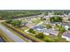 Neighborhood aerial view shows well-maintained homes, green lawns, and solar panels at 1167 Saint Tropez Ct, Kissimmee, FL 34759