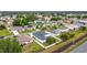 Aerial view of the property with solar panels in a residential community at 1167 Saint Tropez Ct, Kissimmee, FL 34759